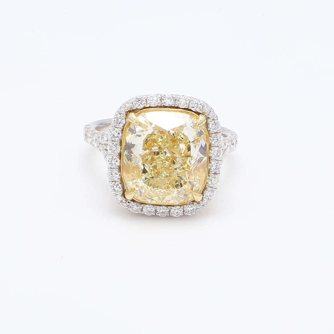 Halo ring in platinum and 18K YG with gallery and pre-set rounds & GIA certified FY/VS2 cushion cut diamond center.  D7.86ct.t.w.  (Center 7.04ct.)