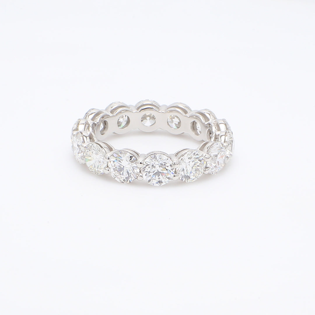 Eternity band in platinum with shared prong round diamonds.  D4.74ct.t.w.