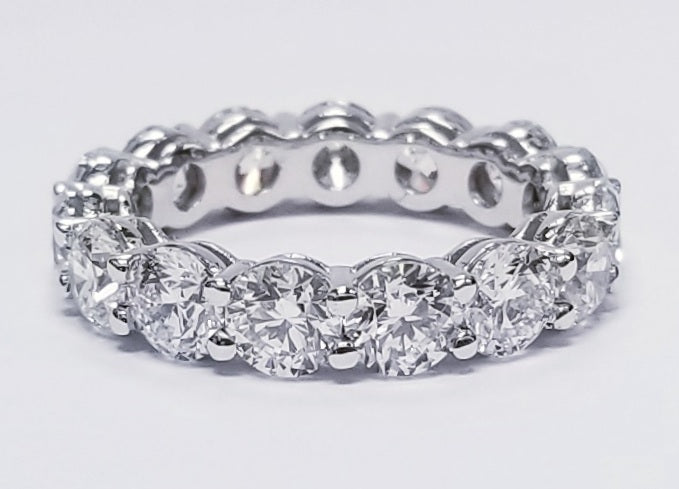 Eternity band in platinum with shared prong set (15) round diamonds. D4.57ct.t.w.  Size 5