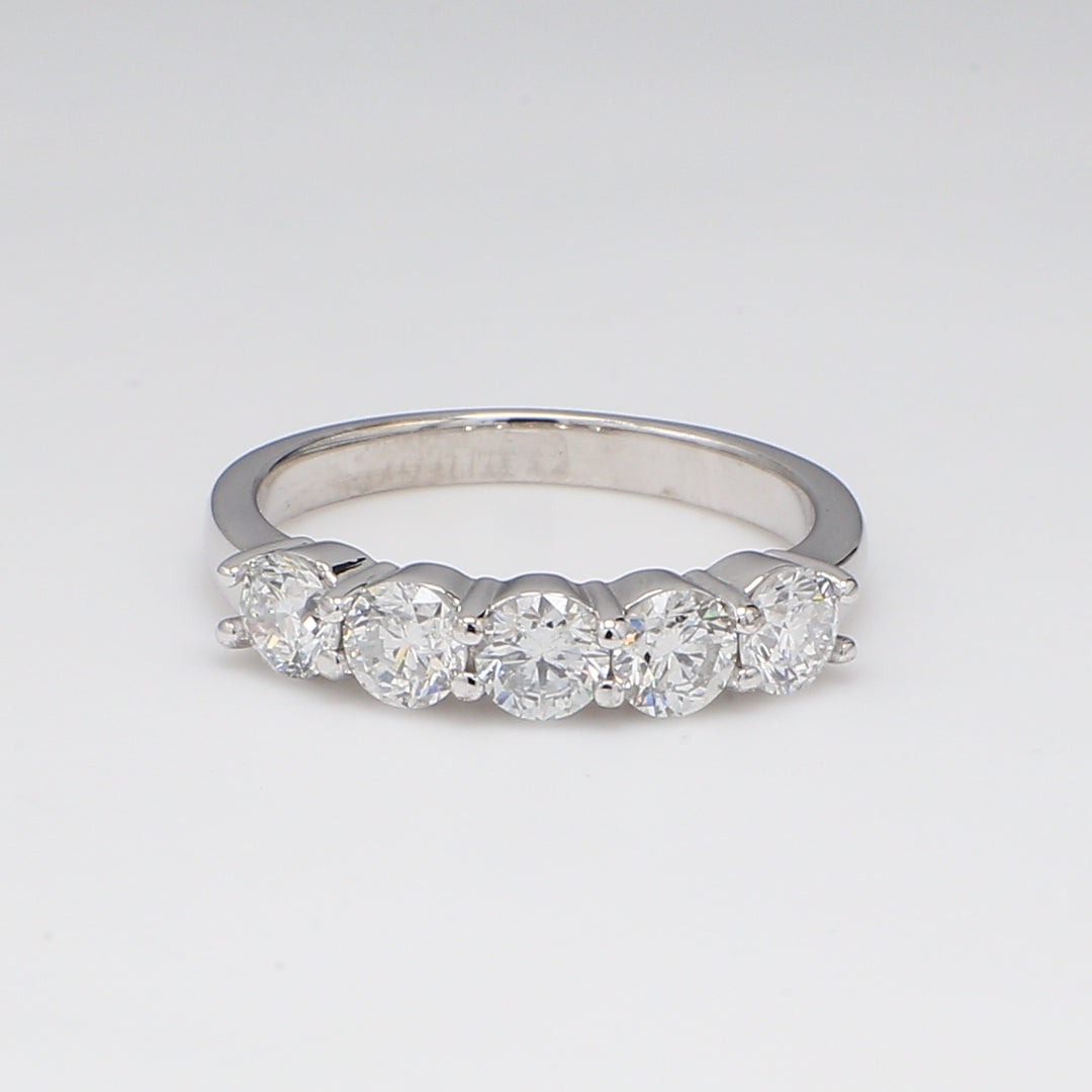 5-stone band with shared prong set round diamonds.  D1.19ct.t.w.
