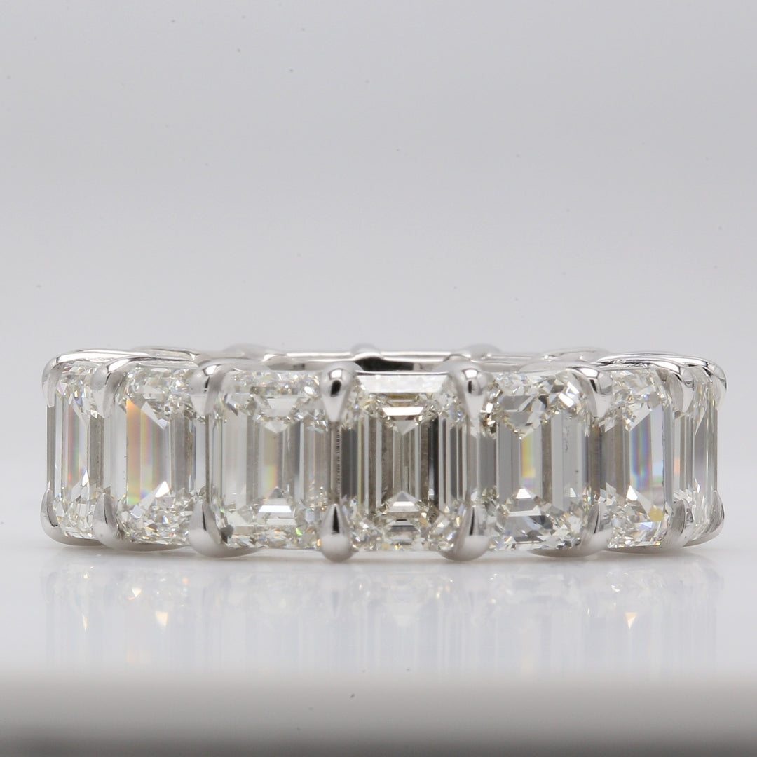Eternity band in platinum with double basket shared prong GIA certified I-J/VVS1-VS2 (15) emerald cut diamonds.  D13.54ct.t.w.  Size 5.75