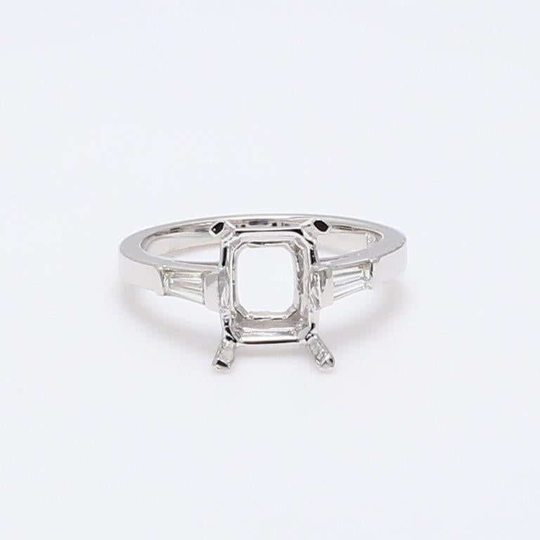 3-stone semi-mount in 18K WG with tapered baguette diamond sides.  D0.23ct.t.w.