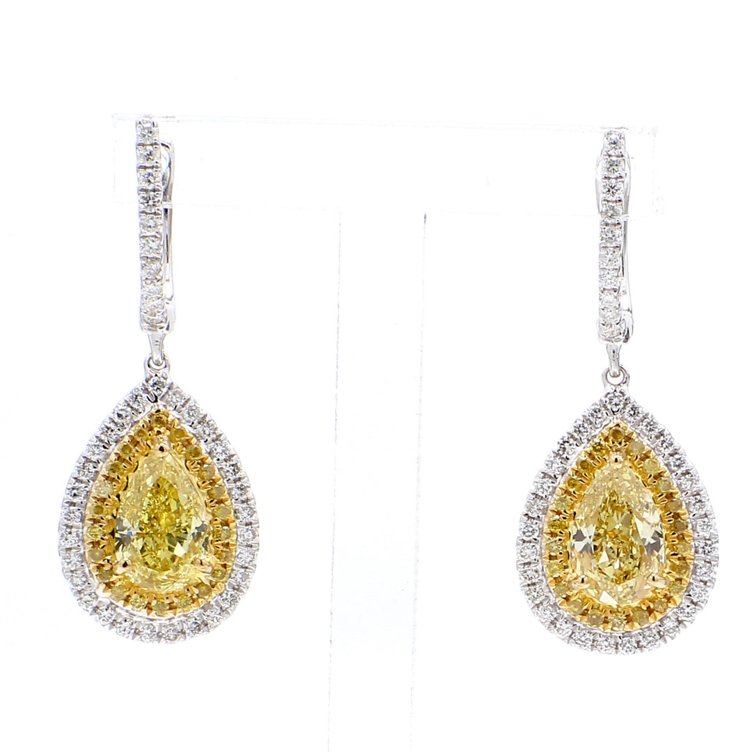 Halo dangling earrings in 18K WG with 3-prong set GIA certified FLY/VVS1-SI1 pear shape centers & prong set round diamonds.  D2.77ct.t.w.  (Centers 2.11ct.t.w.)