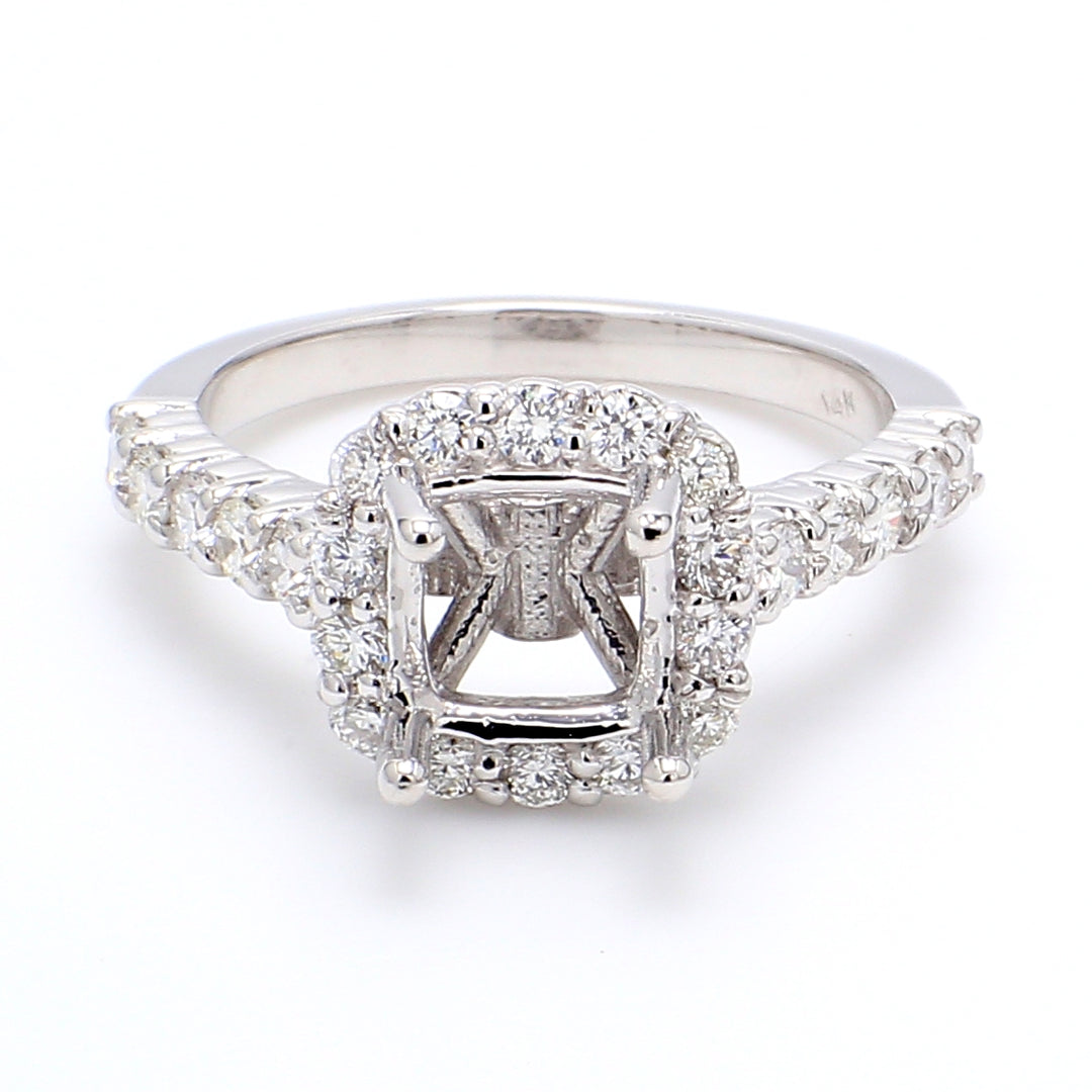 Halo semi-mount with bezel set & 4-prong set round diamonds.  D0.81ct.t.w.  Size 6.25