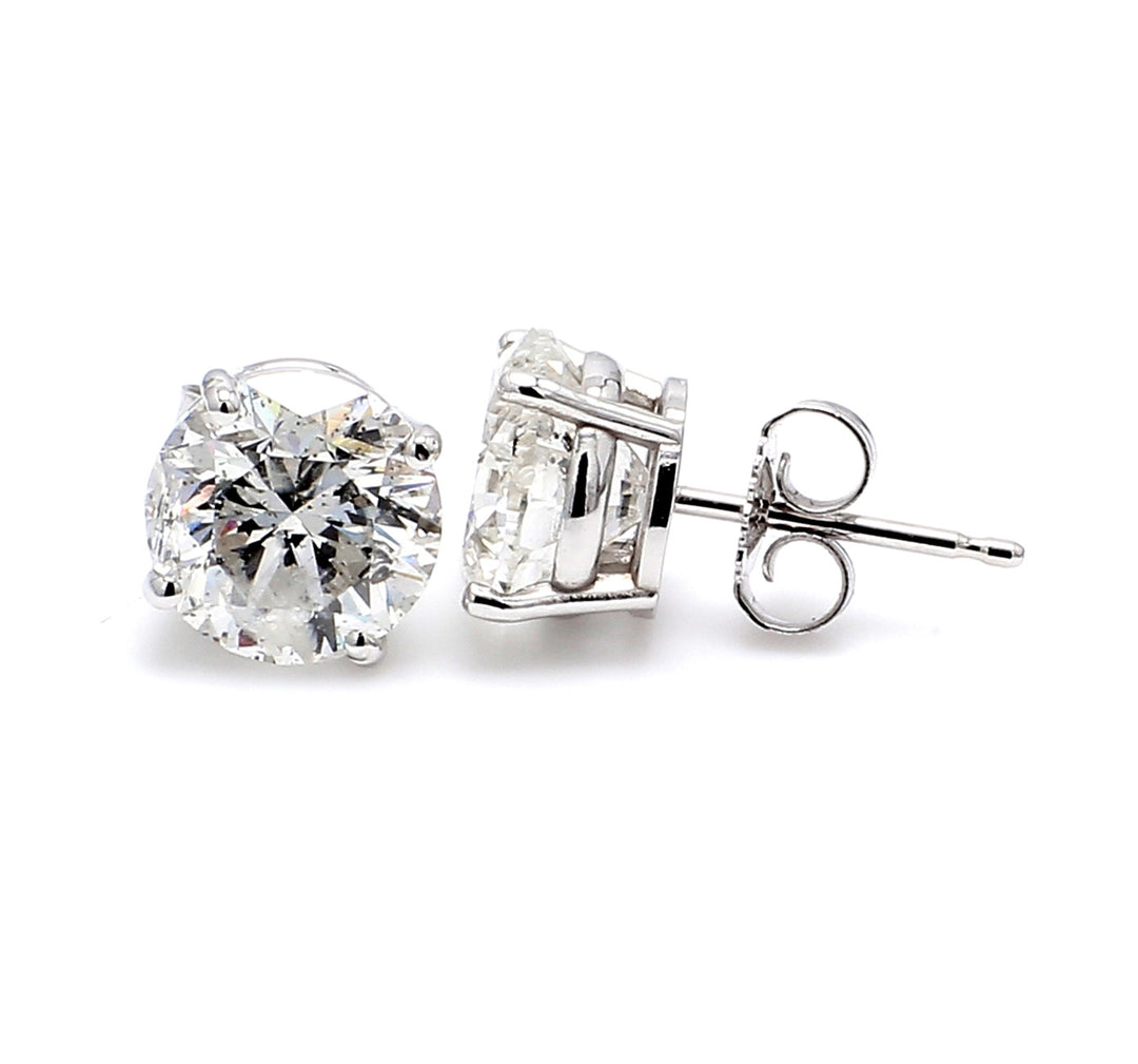 Push back stud earrings with 4-prong set round diamonds.  D0.80ct.t.w.