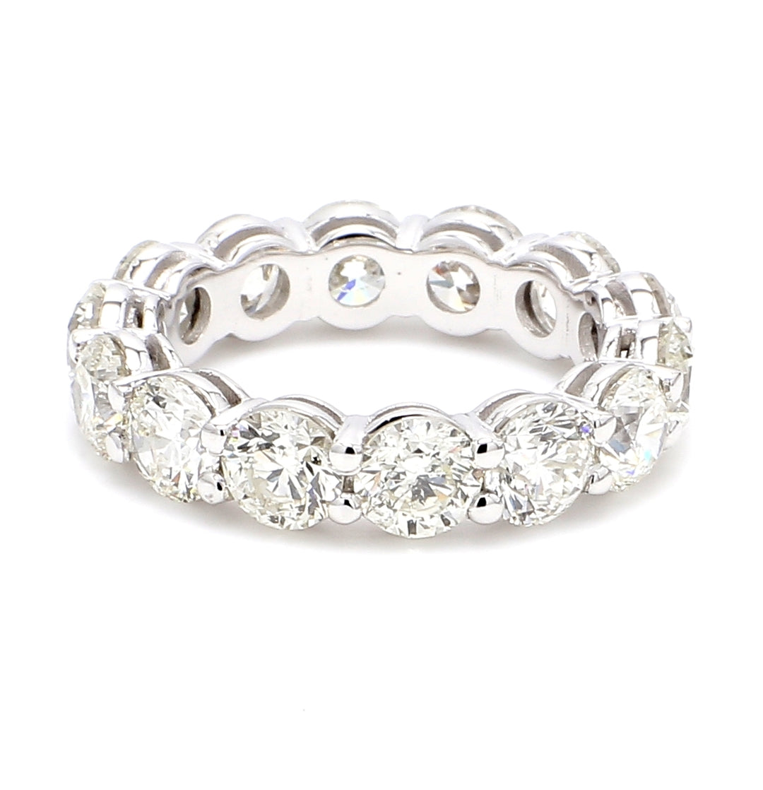 Eternity band with shared prong set (14) round diamonds.  D5.78ct.t.w.  Size 5.75