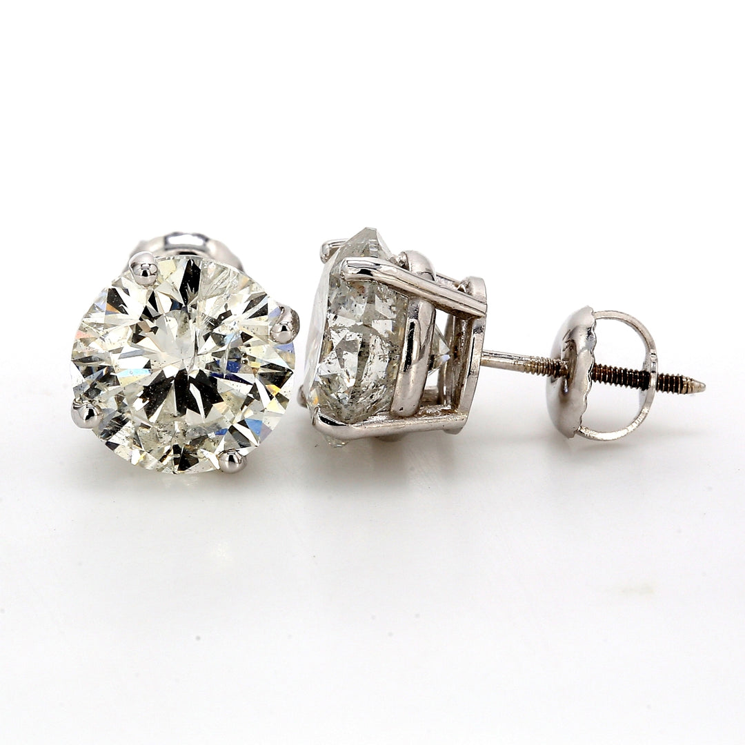 Screw back stud earrings with basket prong set USA certified F-G/SI3-I2 round diamonds.  D5.51ct.t.w.