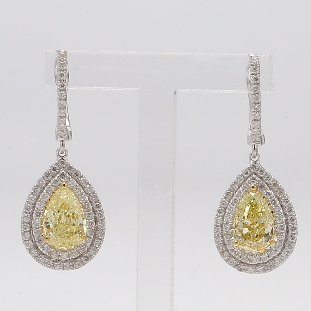 Double halo dangling earrings in 18K WG with pre-set round diamonds around GIA certified FLY/SI1-SI2 pear shape diamond centers.  D2.97ct.t.w.  (Centers 2.25ct.t.w.)