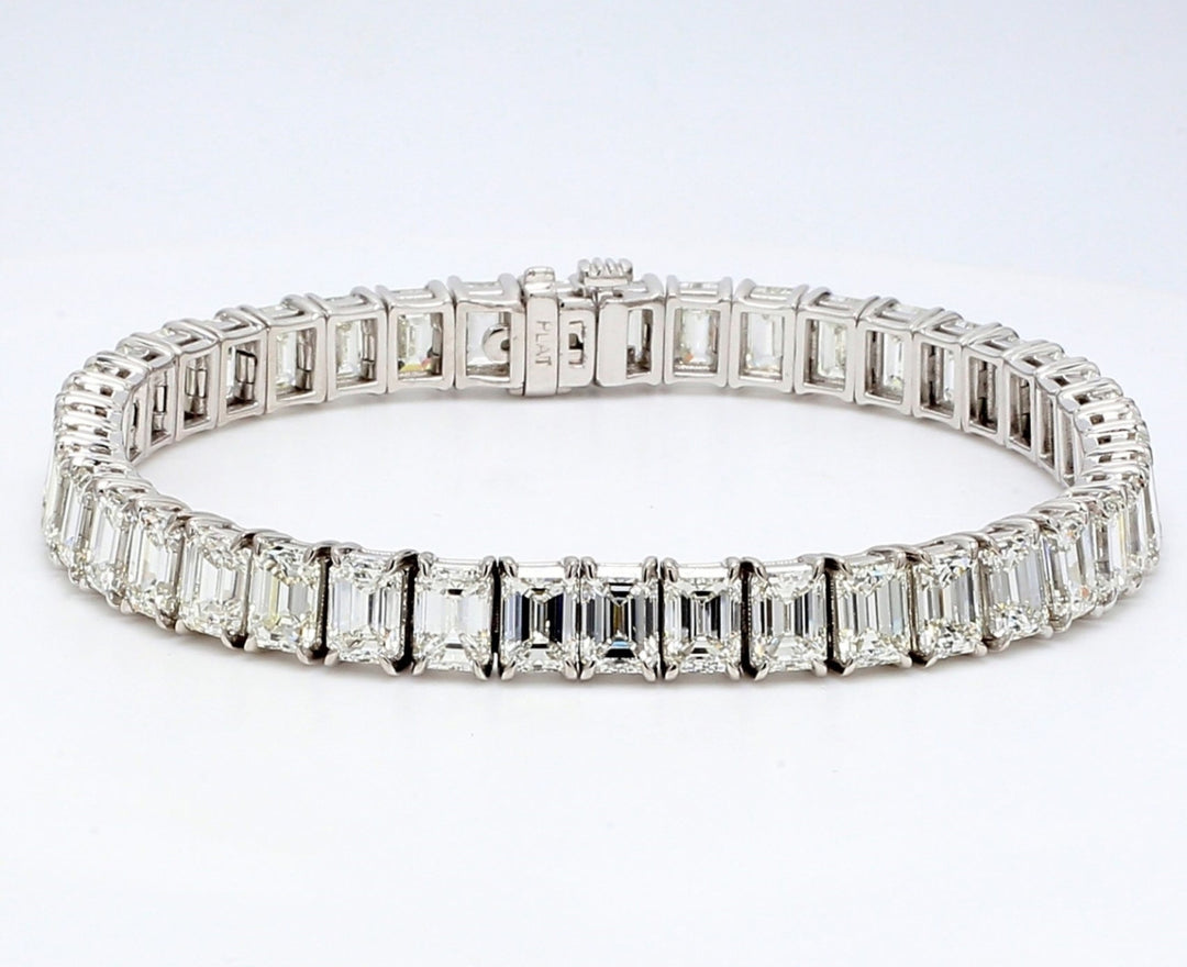 7"" Tennis bracelet in platinum with 4-prong set emerald cut diamonds.  D22.00ct.t.w.