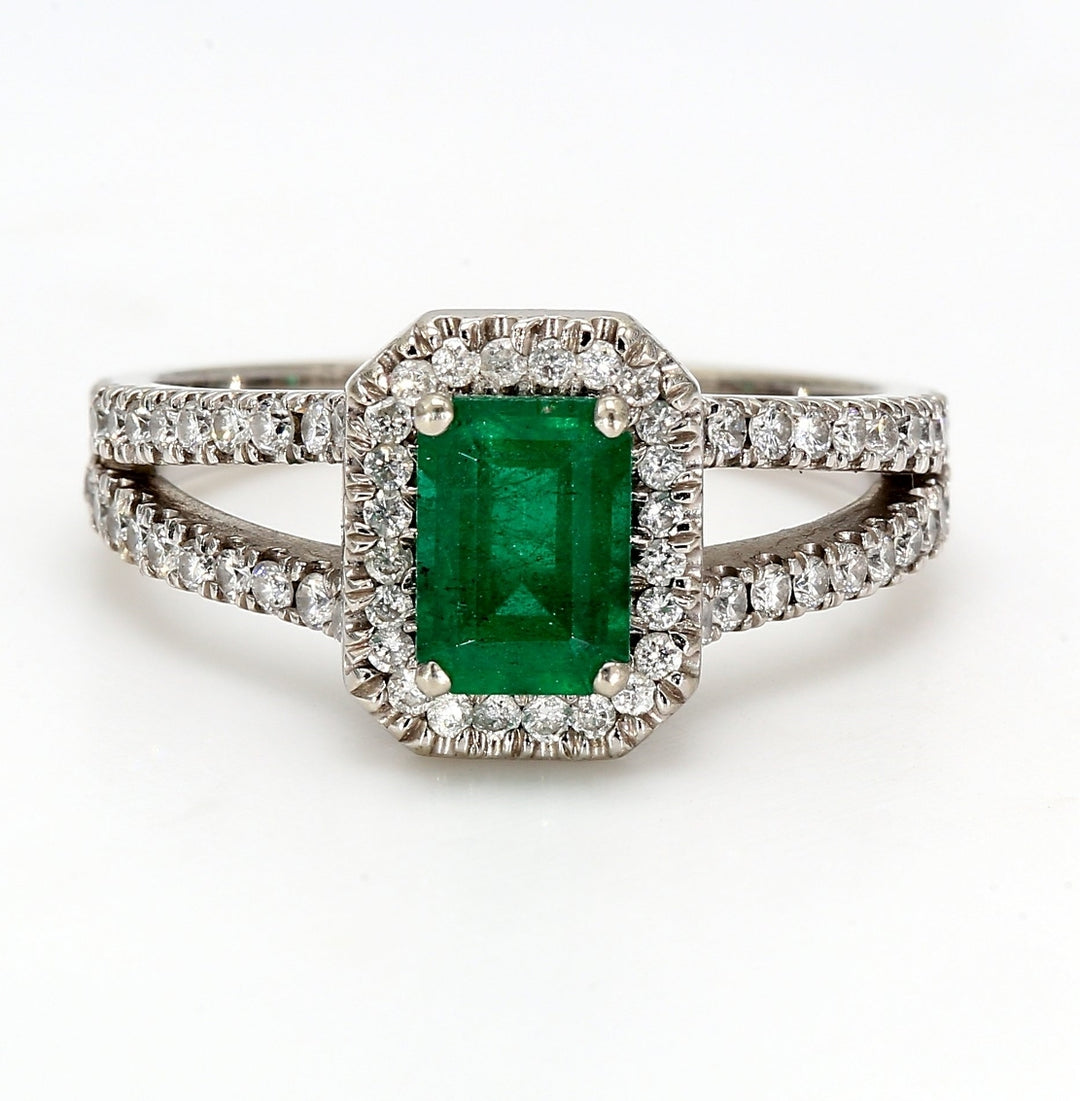 Halo split-shank ring with U-prong set rounds & 4-prong set emerald center.  D0.50ct.t.w.  Emerald 0.90ct.