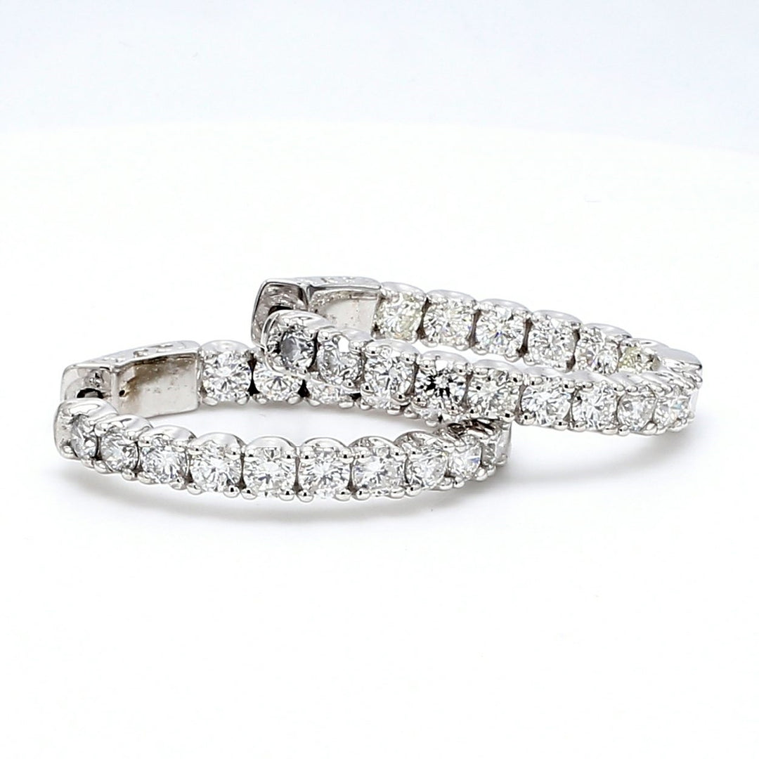 1"" Oval shaped inside out hoop earrings with U-prong set round diamonds & with special spring lock.  D3.58ct.t.w.