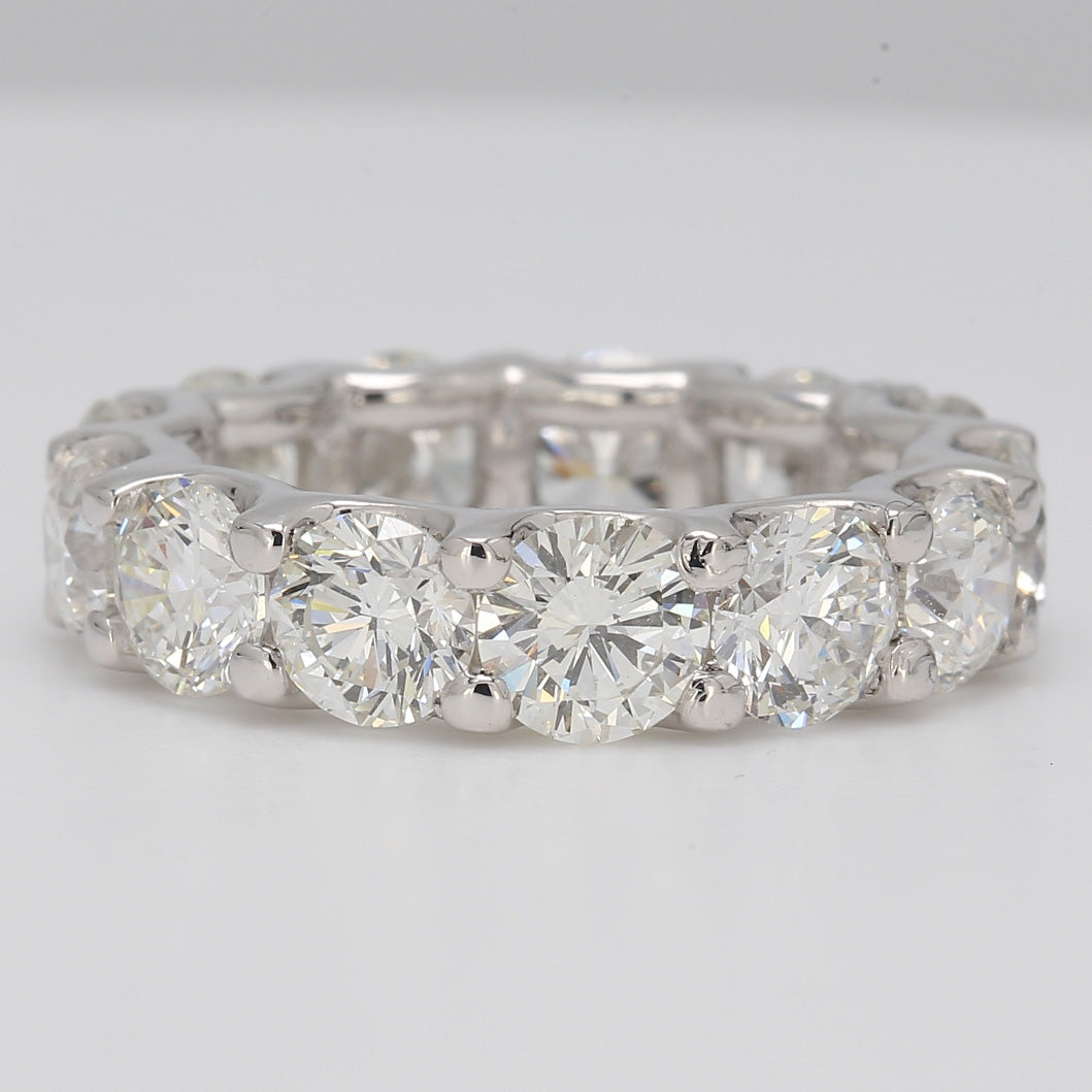 Eternity band in platinum with U-prong set round diamonds.  D6.11ct.t.w.  Size 5.25