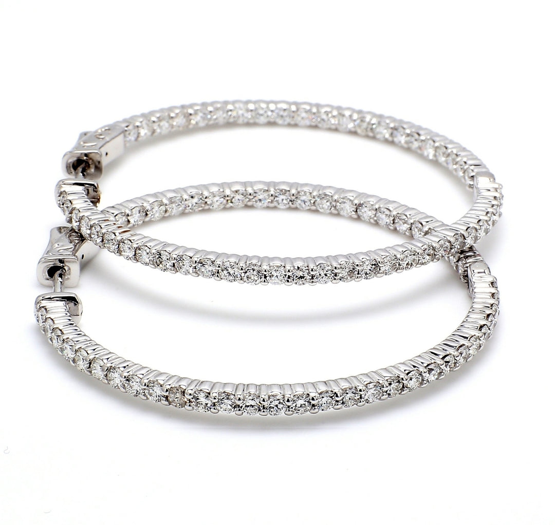 2"" Inside out hoop earrings with shared prong set (150) round diamonds & with special spring lock.  D2.96ct.t.w.