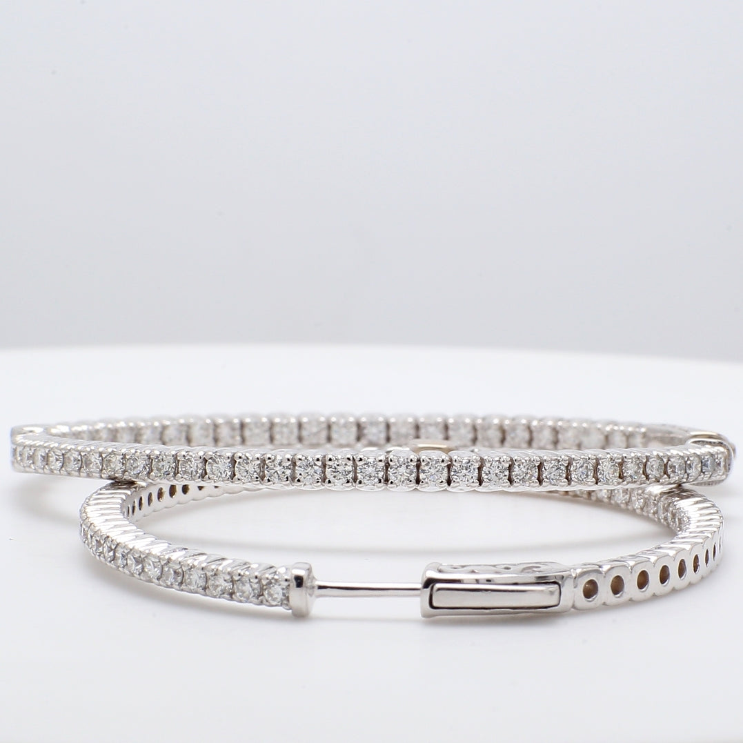 2"" Inside out hoop earrings with shared prong set round diamonds.  D2.37ct.t.w.