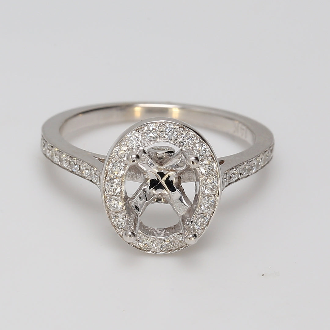 Halo semi-mount with bezel & pre-set round diamonds.  D0.48ct.t.w.