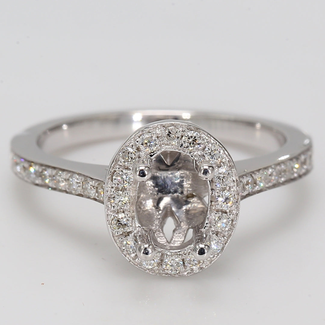Halo semi-mount with shared prong round diamonds.  D0.42ct.t.w.