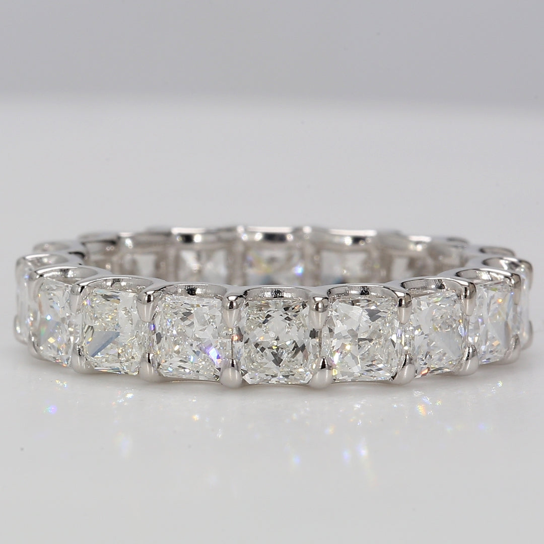 Eternity band in Platinum with U-prong set F+/VS+ (18) square radiant diamonds.  D4.46ct.t.w.  Size 6.75