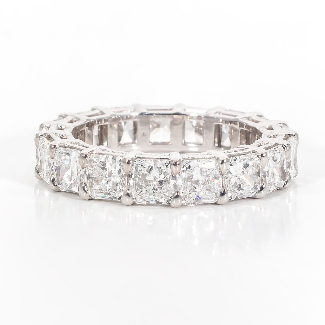 Eternity band in platinum with basket set F+/VS+ (18) square radiant diamonds.  D4.57ct.t.w.  Size 6.25