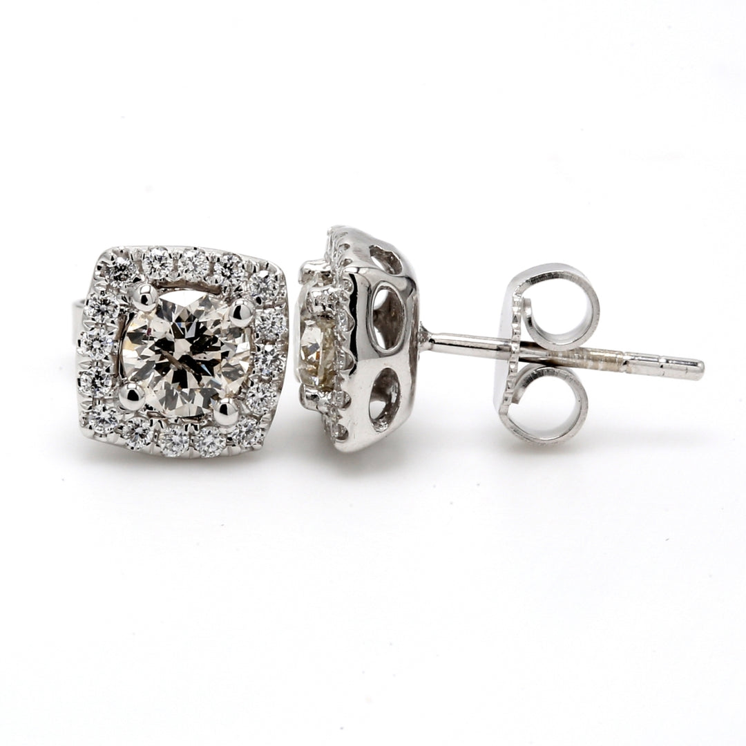 Halo push back stud earrings in 18K WG with 4-prong set round diamonds.  D1.14ct.t.w.  (Centers 0.82ct.t.w.)