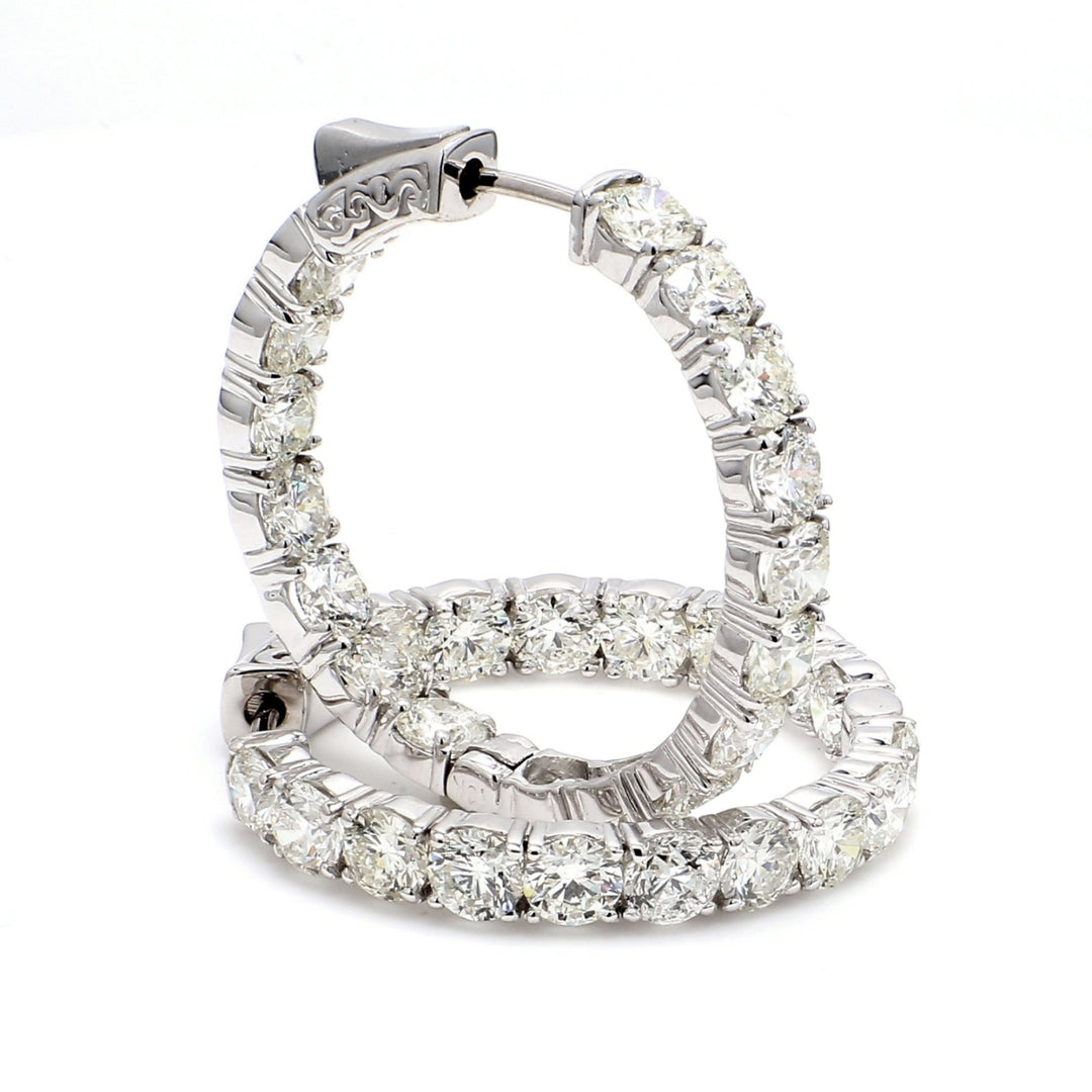 1.25"" Inside out hoop earrings in 18K WG with 4-prong set (34) round diamonds & with special spring lock.  D8.51ct.t.w.