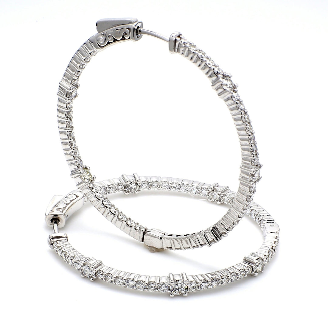 1.5"" Inside out hoop earrings with 4-prong set (96) round diamonds & with special spring lock.  D2.68ct.t.w.
