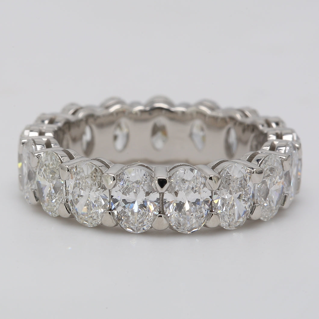 Eternity band in platinum with shared prong set (17) oval diamonds.  D5.02ct.t.w.  Size 6.25