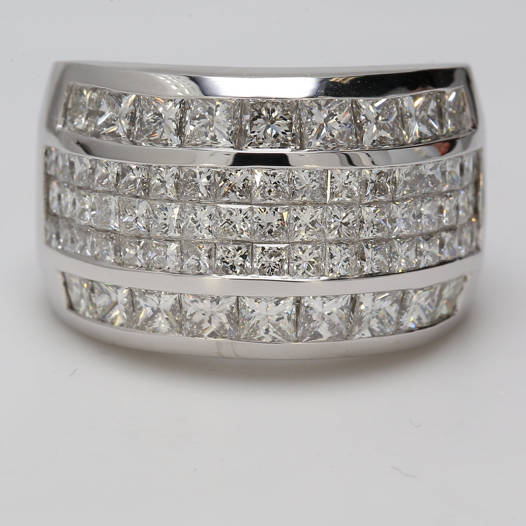 Ring in platinum with 3-row invisible set princess cuts in the middle & channel set princess cut diamonds outer sides.  D5.19ct.t.w.   Size 9