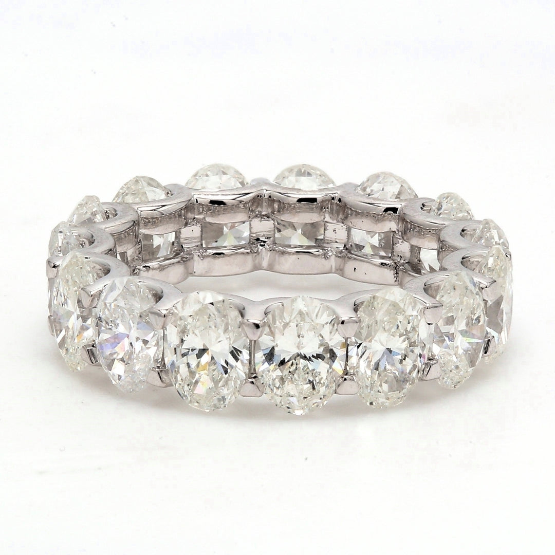 Eternity band in platinum with U-prong set G/VS (15) oval diamonds.  D7.67ct.t.w.  Size 6