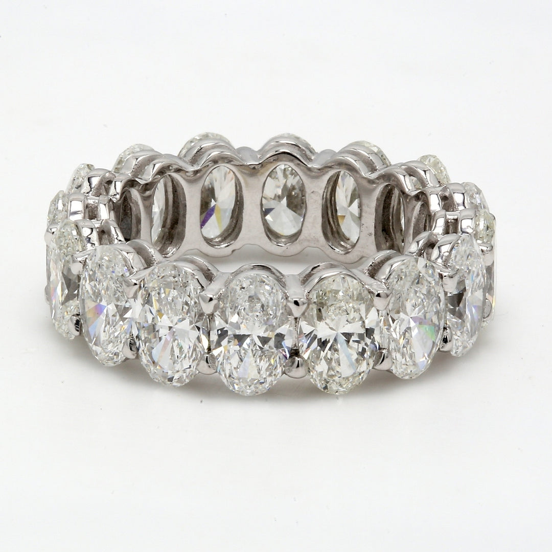 Eternity band in platinum with basket set G/VS-SI1 (16) oval diamonds.  D8.13ct.t.w.  Size 6.5