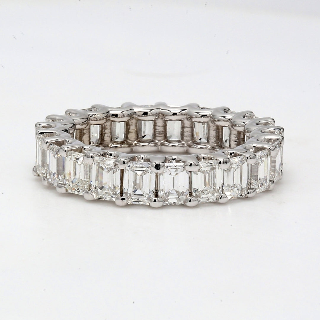Eternity band with shared U-prong set (22) emerald cut diamonds.  D3.74ct.t.w.  Size 5