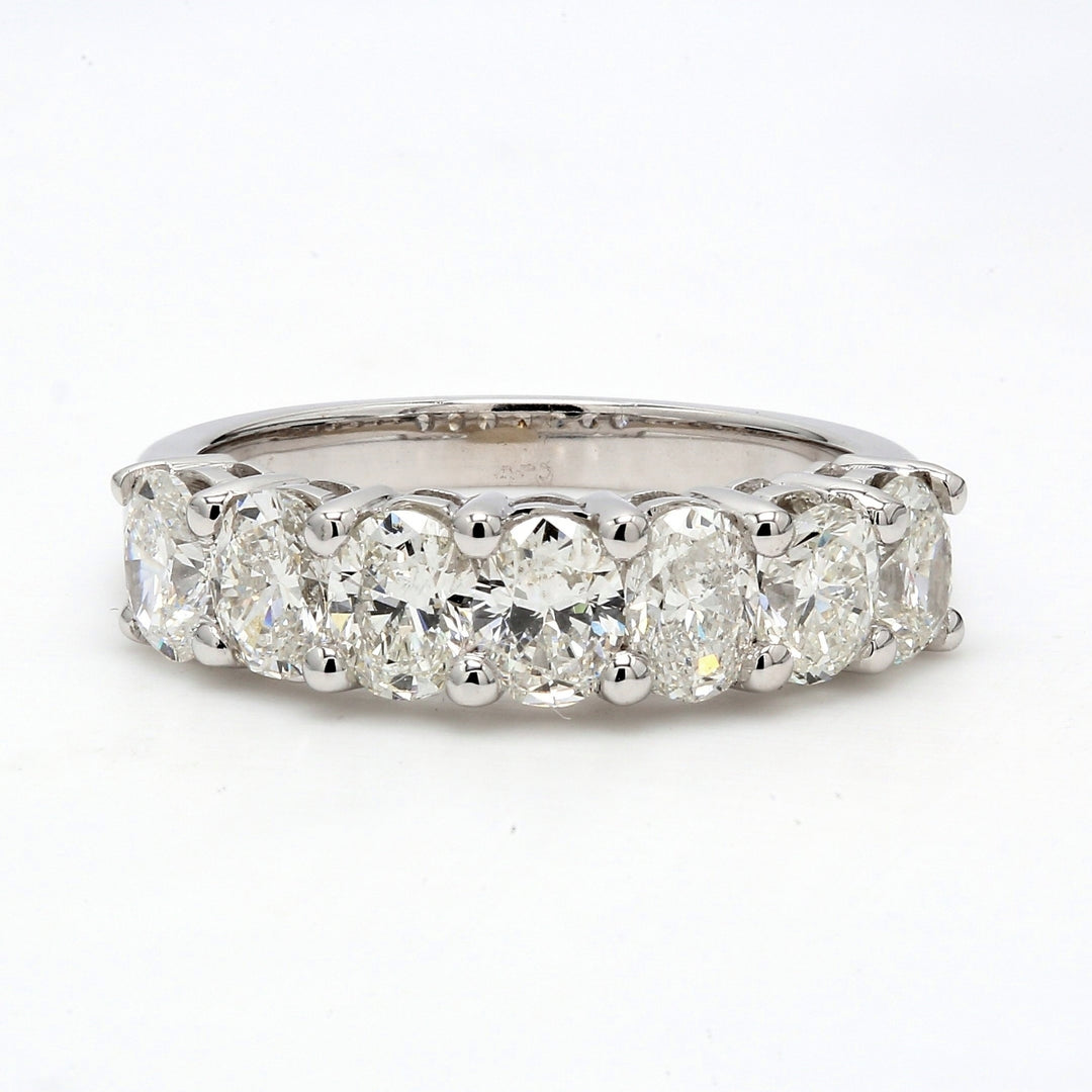 7-stone band in 18K WG with shared prong set oval cut diamonds.  D2.14ct.t.w.  Size 6.5