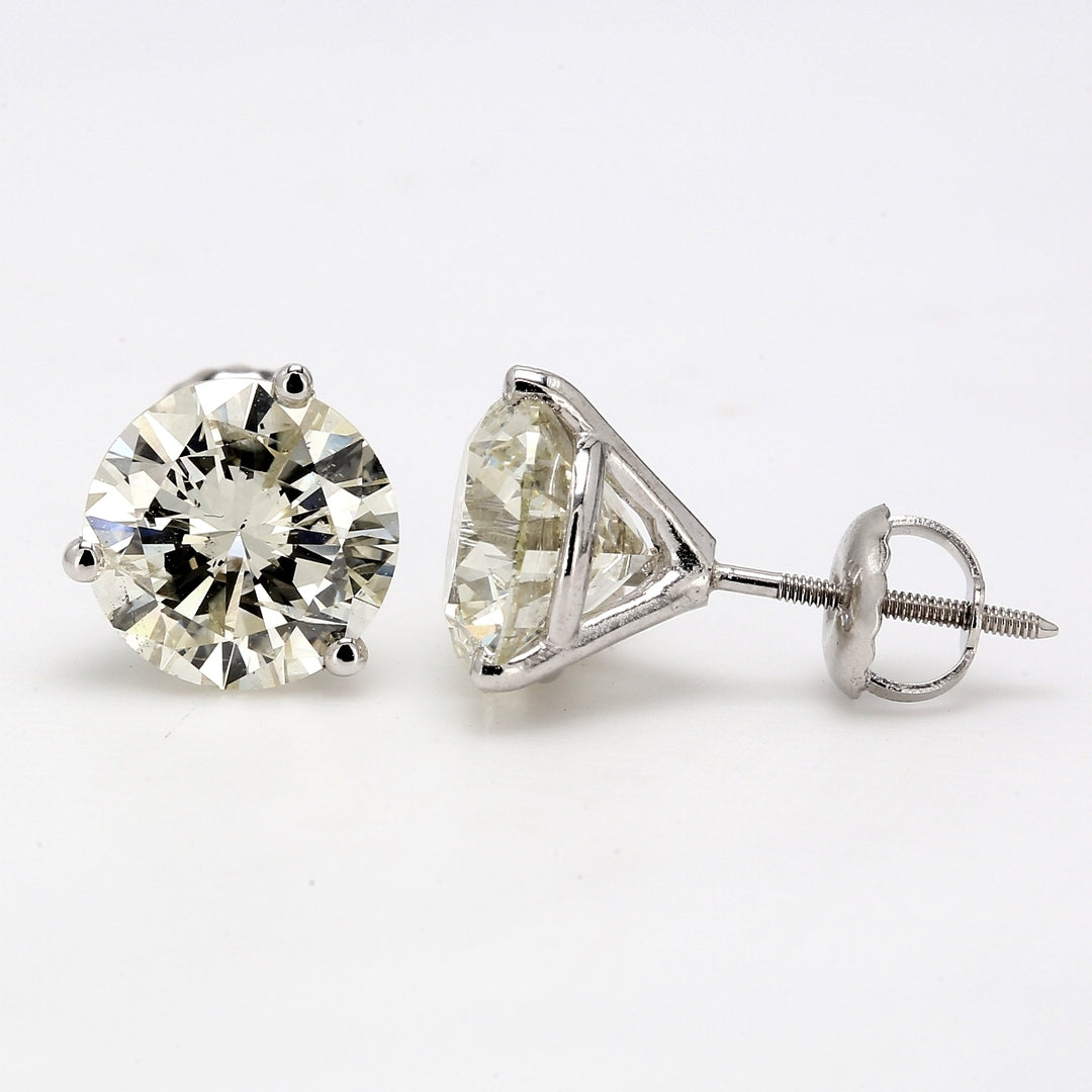 Screw back martini style stud earrings with 3-prong set USA certified K-L/SI2-SI3 round diamonds.  D4.67ct.t.w.