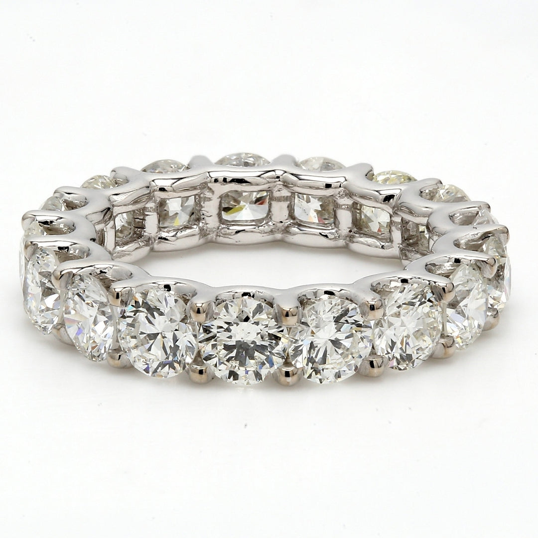 Eternity band with shared U-prong set (17) round diamonds.  D5.40ct.t.w.  Size 6.25