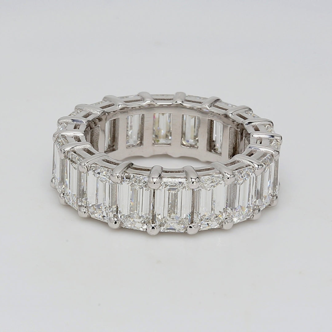 Eternity band in platinum with shared prong basket set GIA certified D-F/VVS1-VS1 (18) emerald cut diamonds.  D9.07ct.t.w.  Size 6