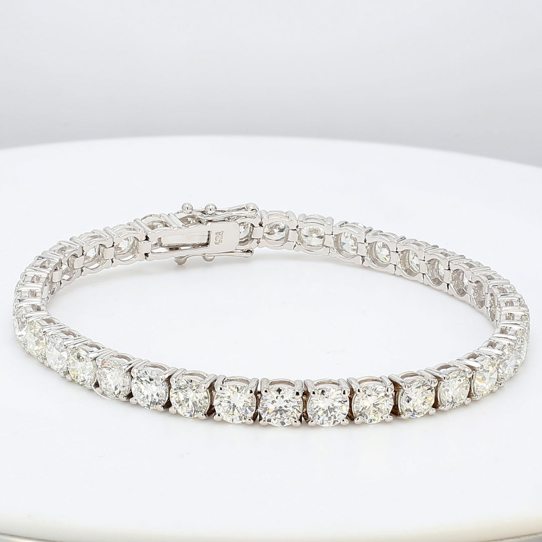 7"" Tennis bracelet in 18K WG with prong set (36) round diamonds.  D14.61ct.t.w.