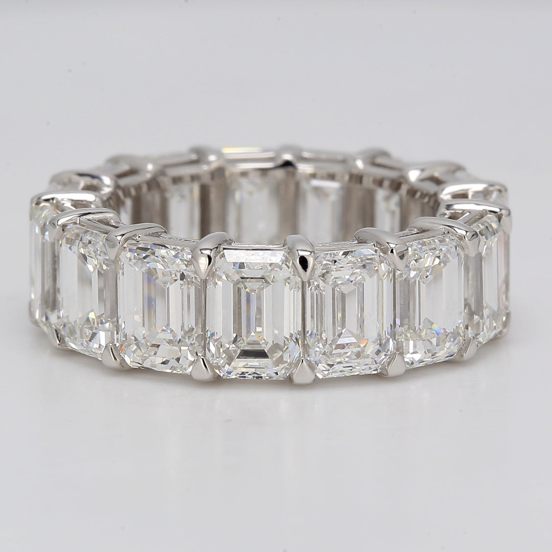 Eternity band in platinum with shared eagle claw basket set GIA certified D-F/VVS1-SI1 (15) emerald cut diamonds.  D11.89ct.t.w.  Size 5.5