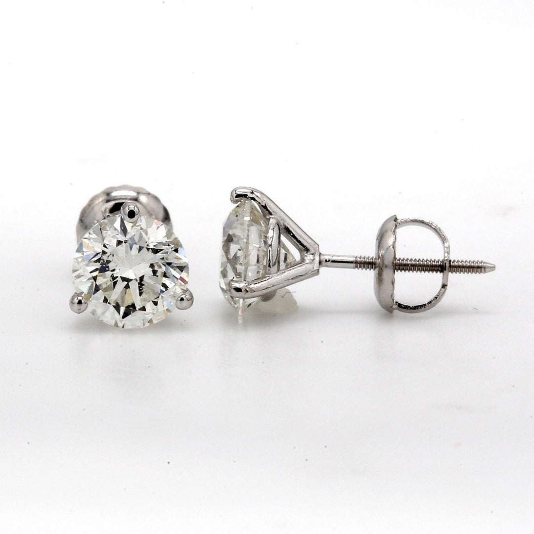 Screw back stud earrings with 3-prong set GIA certified I/I1 round diamonds.  D2.03ct.t.w.