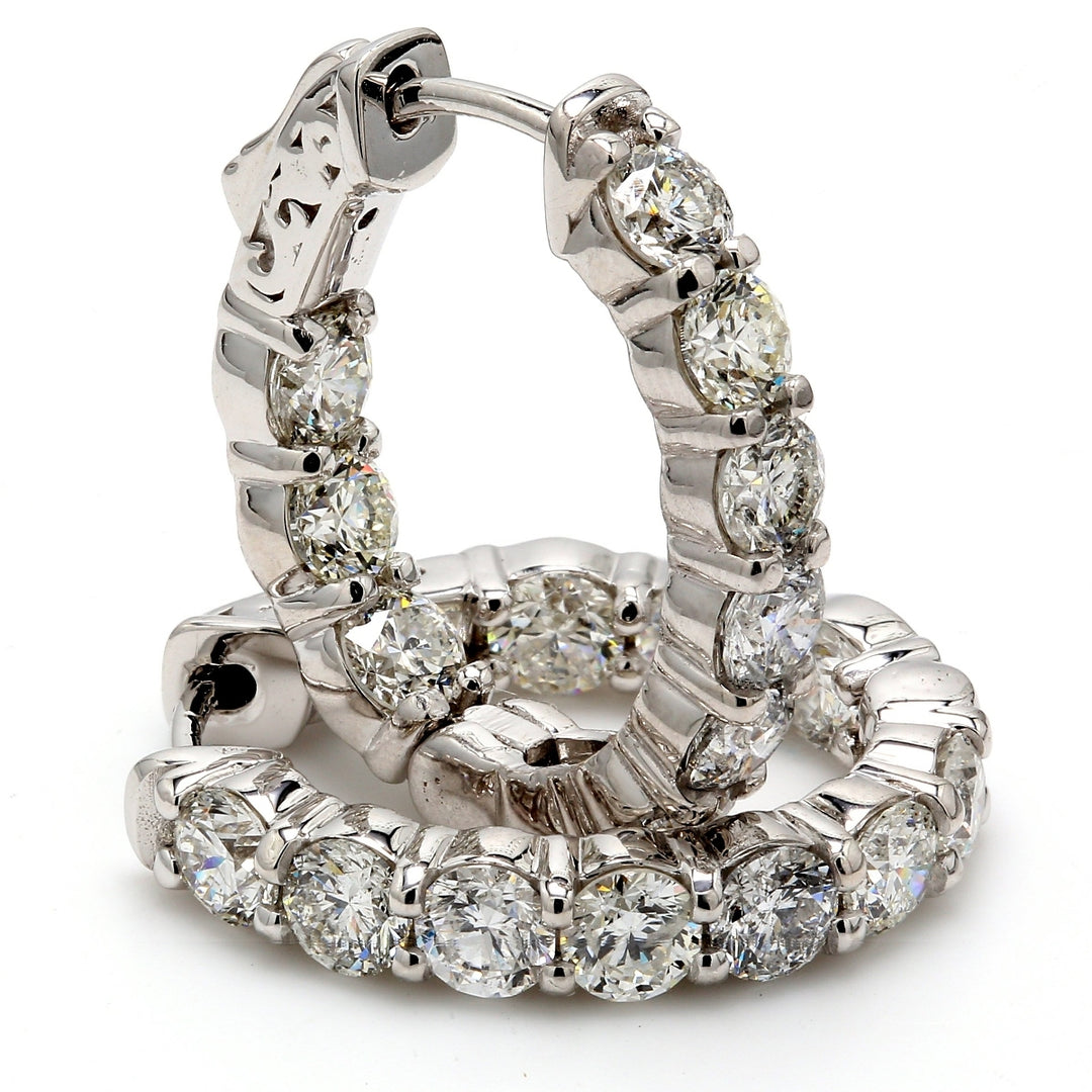0.75"" Oval shaped inside out hoop earrings with shared prong set (20) round diamonds & with special spring lock.  D4.72ct.t.w.