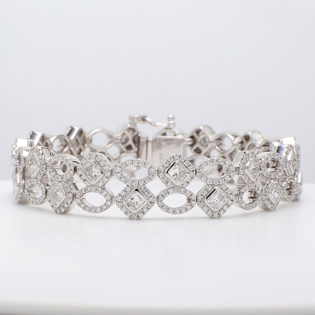 7"" Designer bracelet in 18K WG with pre-set rounds & bezel set radiant cut diamonds.  D7.62ct.t.w.