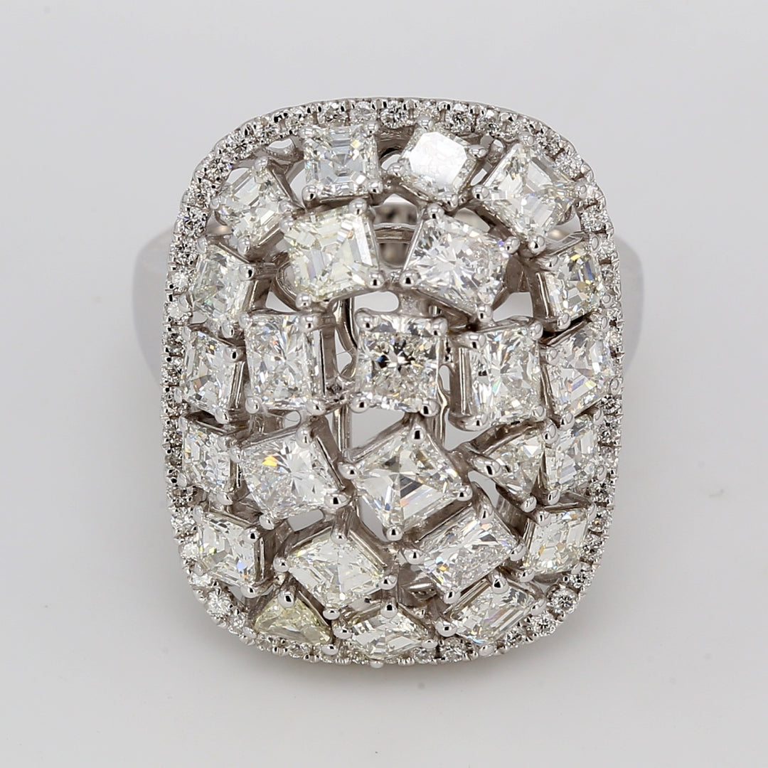 Halo fashion ring in 18K WG with french pave set rounds around prong set asscher, princess, radiant, & trilliant cut diamonds in the middle.  D3.95ct.t.w.