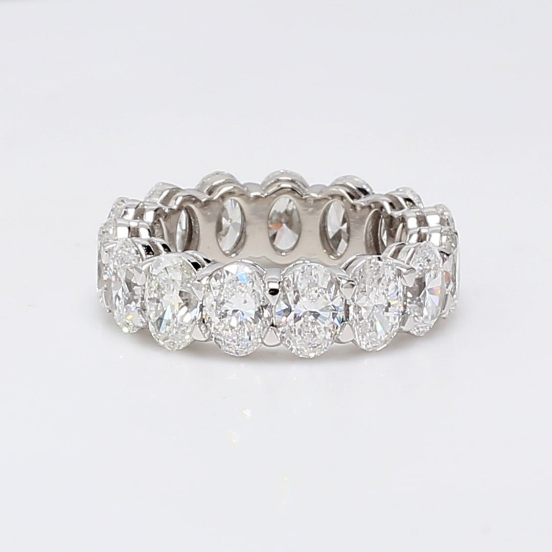 Eternity band in platinum with shared prong basket set D-F/SI (15) oval diamonds.  D7.89ct.t.w.  Size 6
