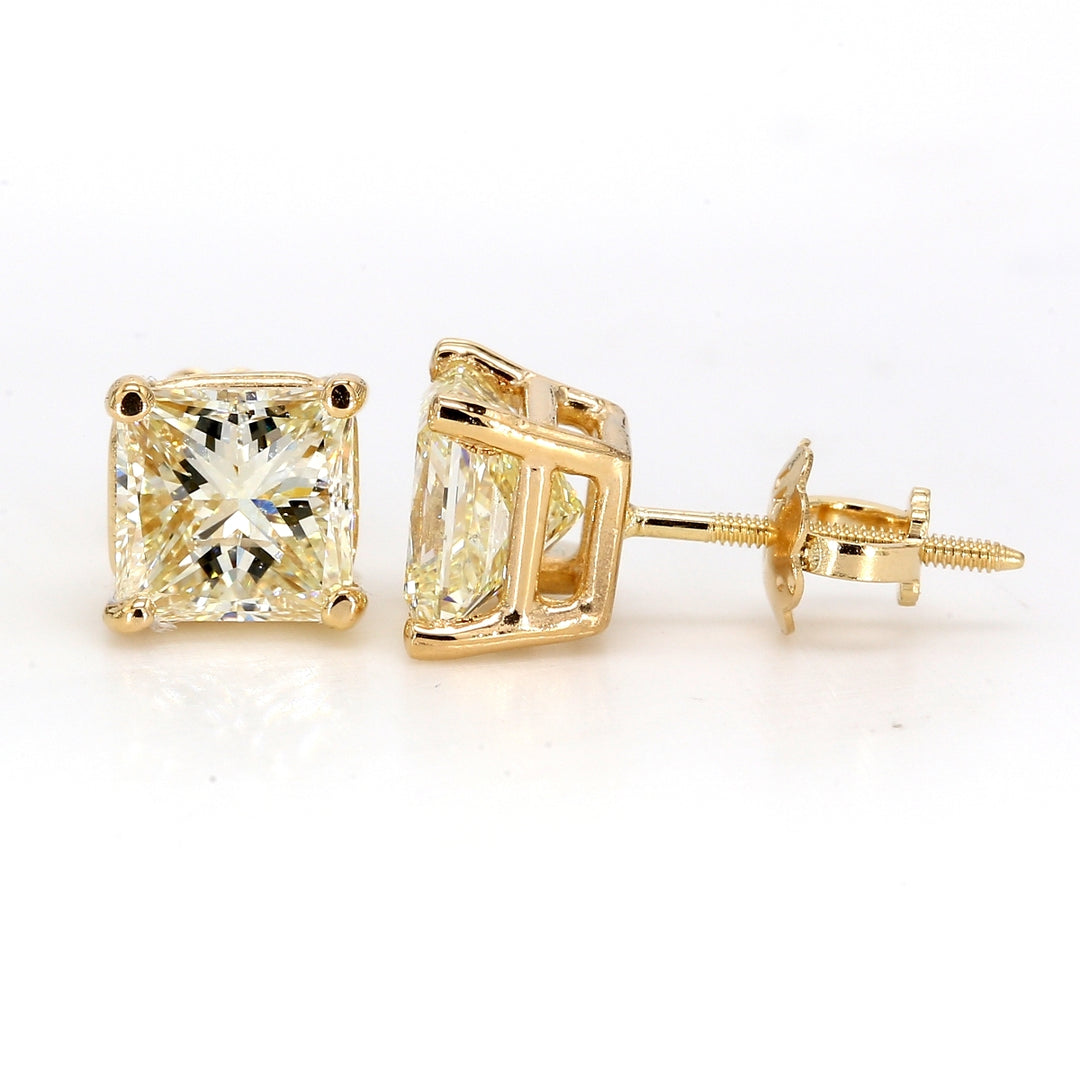 Screw back stud earrings in 14K YG with 4-prong set princess cut diamonds.  D2.12ct.t.w.