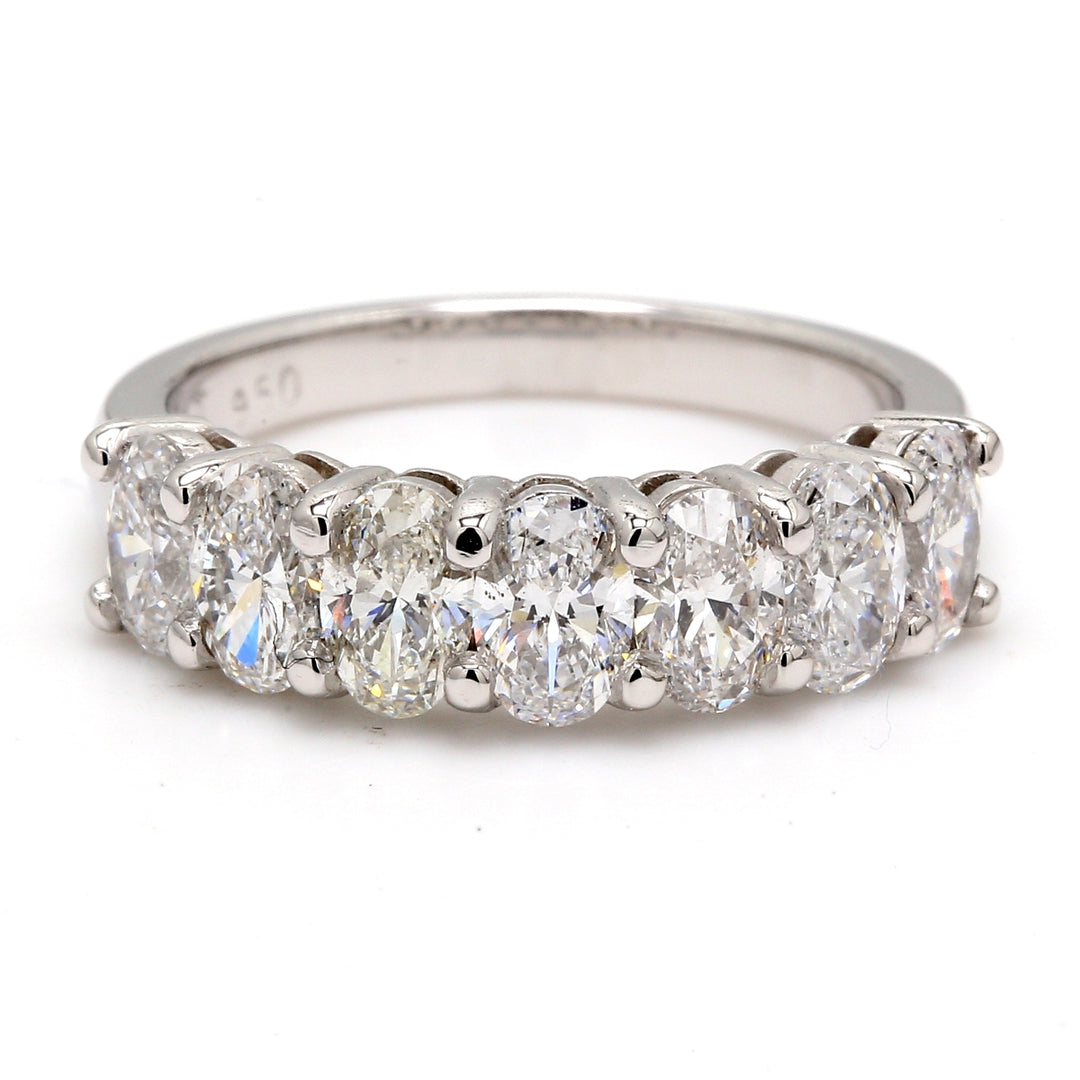 7-stone band in platinum with shared prong set oval cut diamonds.  D2.14ct.t.w.  Size 7