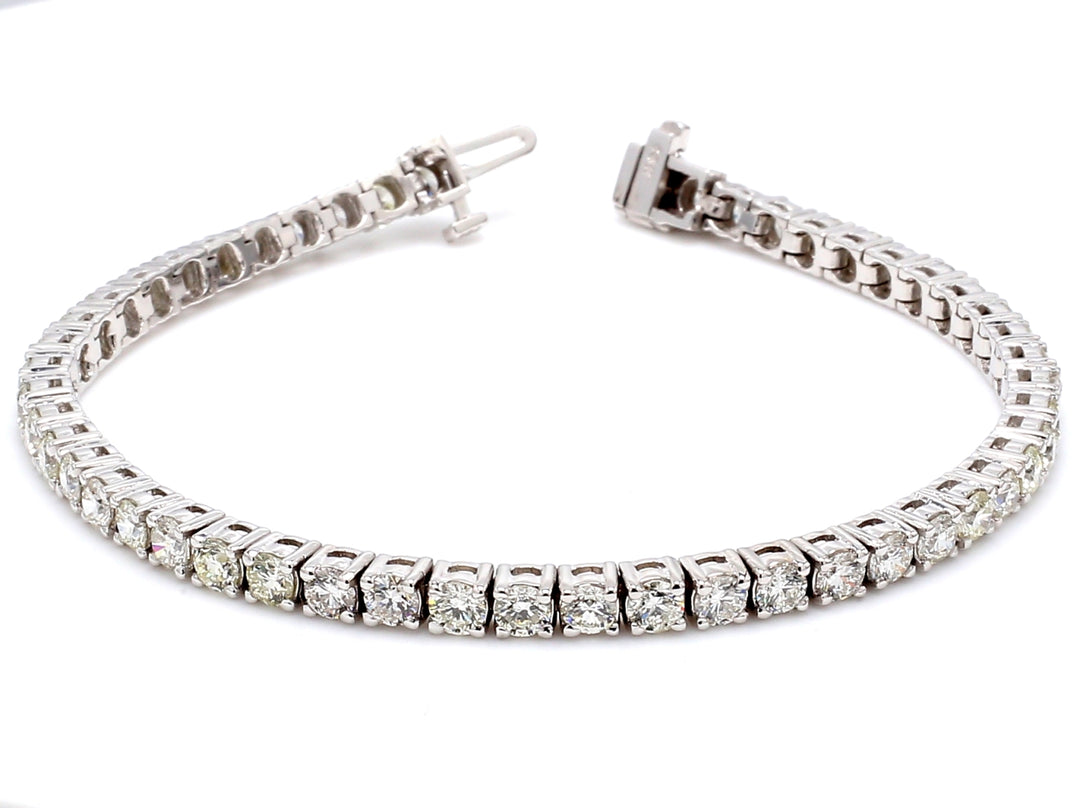 7"" Tennis bracelet with 4-prong set (50) round diamonds.  D6.50ct.t.w.