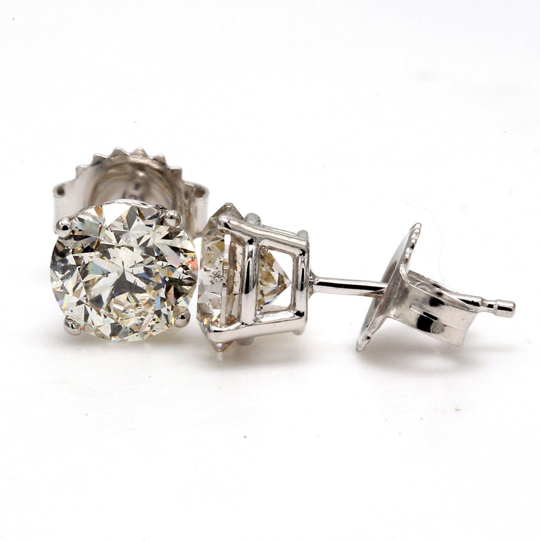 Push back stud earrings with 4-prong set USA certified F-G/SI3 round diamonds.  D2.45ct.t.w.