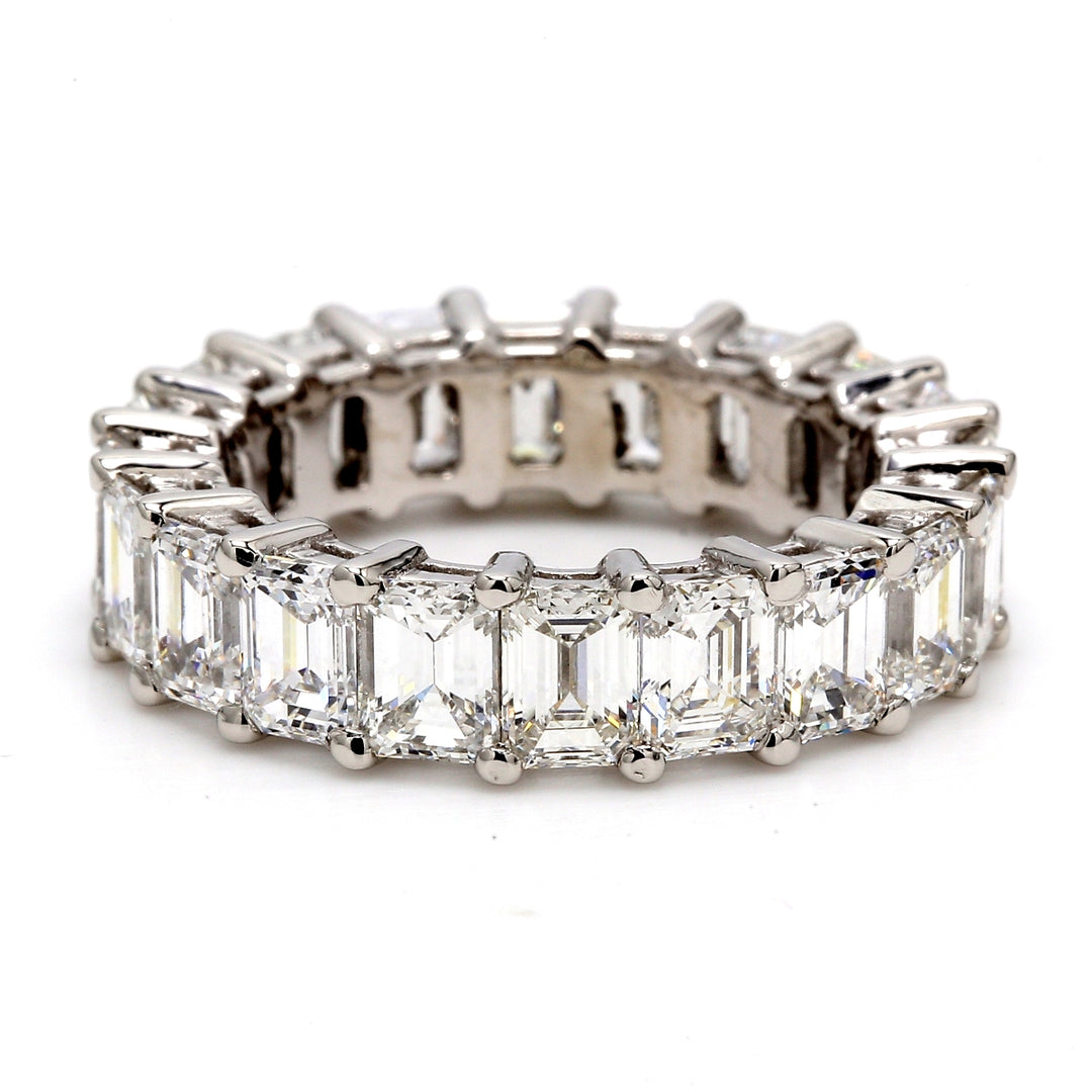 Eternity band in platinum with shared prong set F+/VVS-VS emerald cut diamonds.  D6.53ct.t.w.
