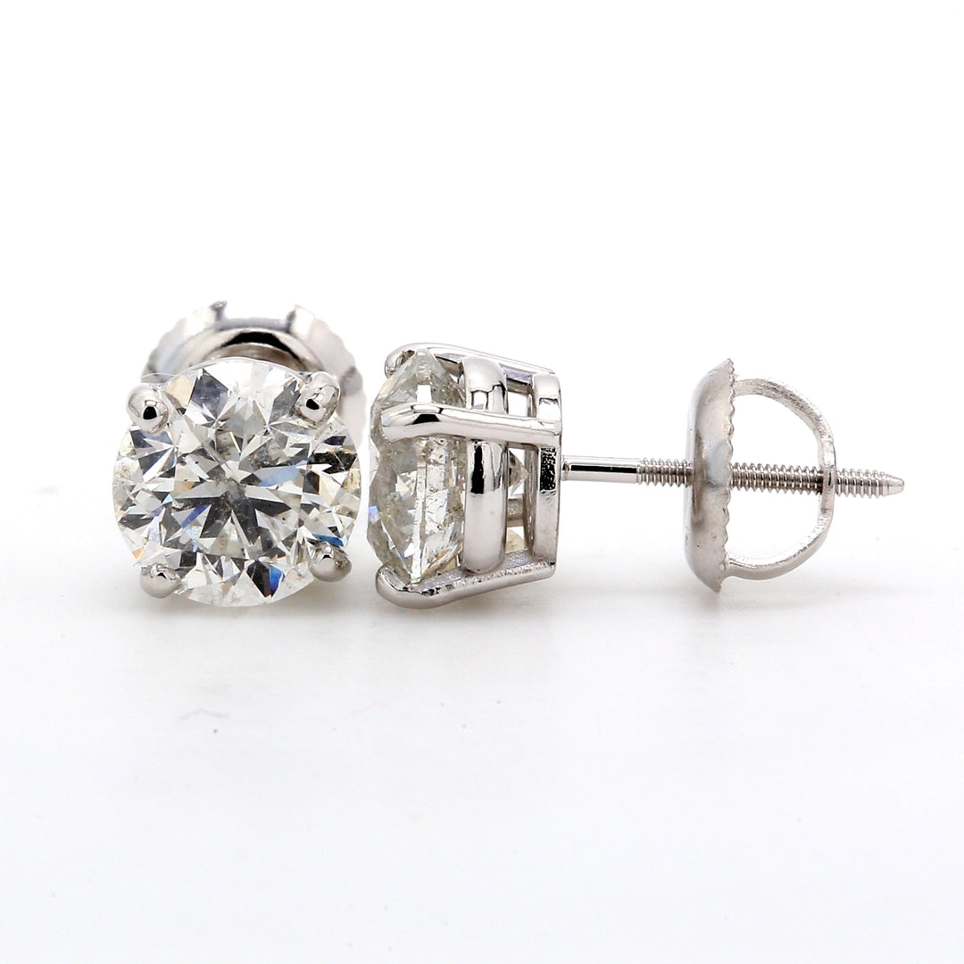 Screw back stud earrings with 4-prong set round diamonds.  D2.07ct.t.w.