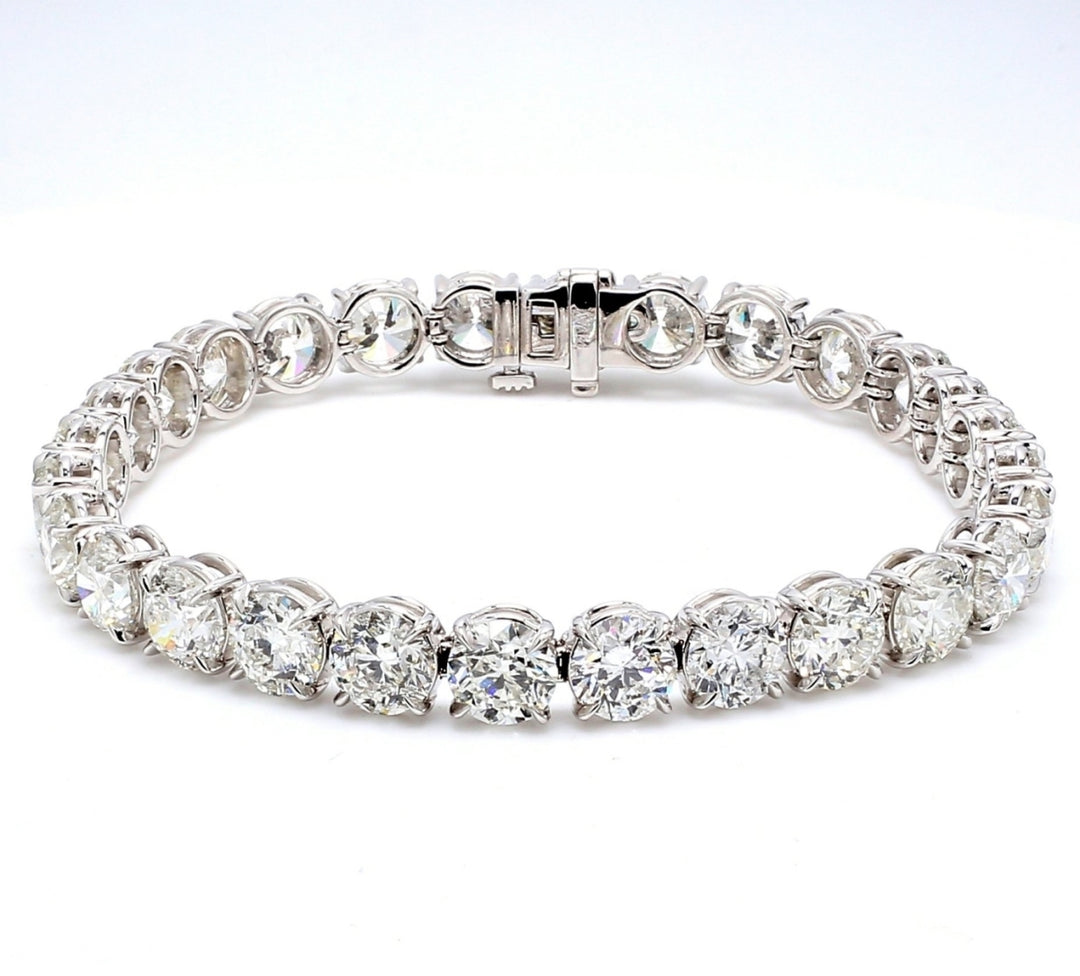 7"" Tennis bracelet in platinum with eagle claw style 4-prong set (28) round diamonds.  D28.59ct.t.w.