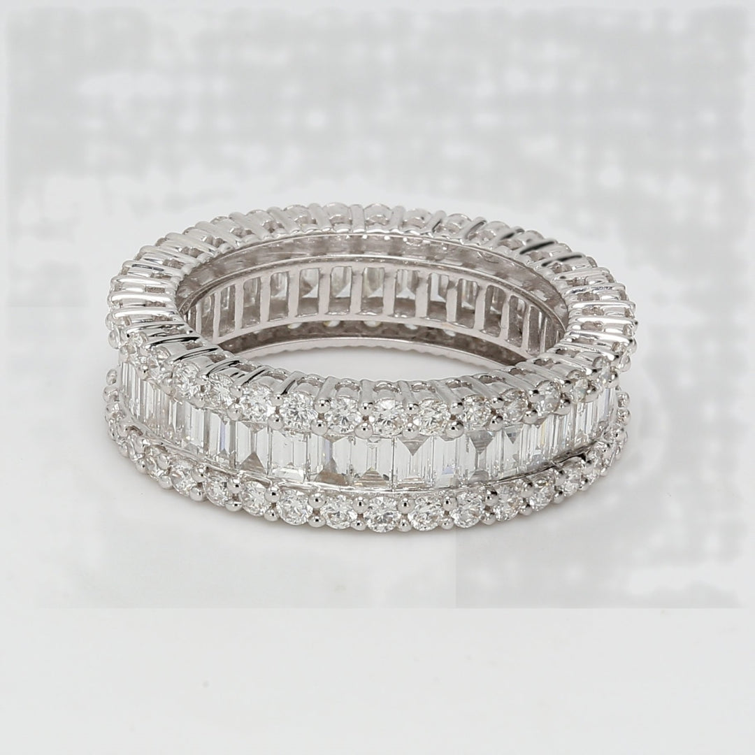 Eternity band in 18K WG with shared prong set rounds & channel set baguette diamonds.  D2.99ct.t.w.  Size 7