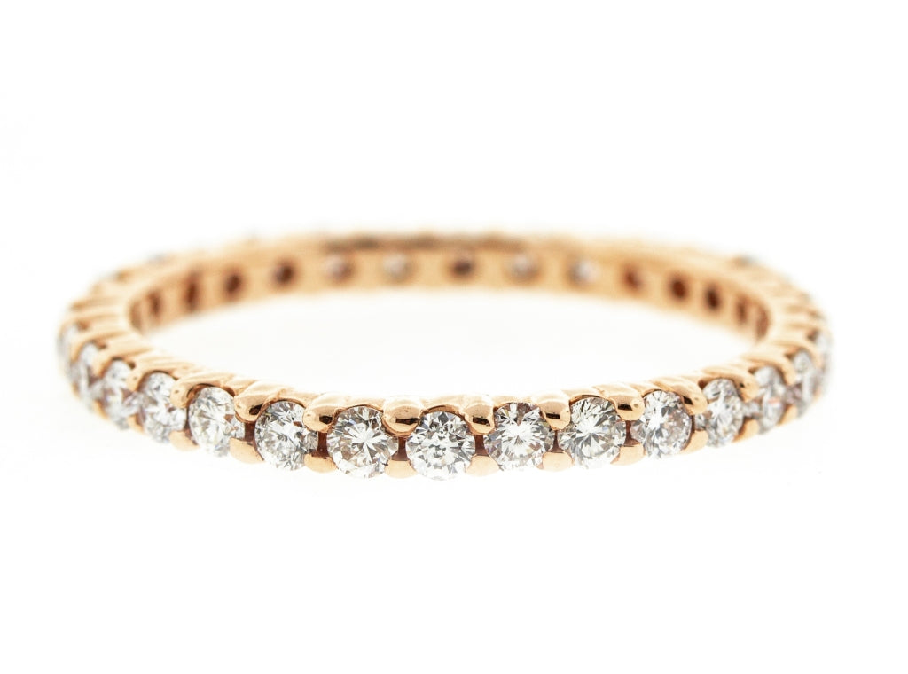 Eternity band in yellow gold with shared prong set (21) round diamonds.  D1.48ct.t.w.